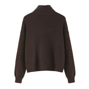 Detail view of a solid dark brown turtleneck knit sweater, soft texture, cozy winter apparel.