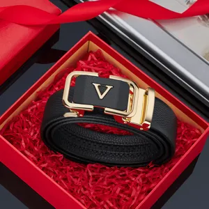 Luxury men's leather belt with gold V buckle in a red gift box for business fashion style.