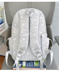 Grijs rugzak met witte stippen voor school en dagelijks gebruik, ruime casual tas.