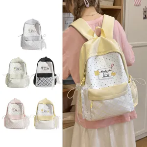 Cute aesthetic school backpack with polka dots and bow for women student daily casual use