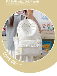 Cute polka dot backpack with lace trim and bow pendant, sweet aesthetic school style daily bag.