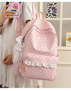 Pink polka dot backpack cute student school bag with lace ruffles and bow pendant sweet style.