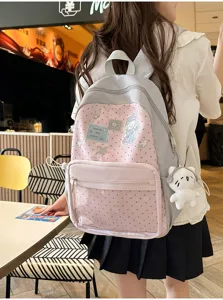 Sac à dos scolaire rose et gris à pois vue détaillée avec poche latérale et peluche