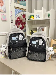 Joli sac à dos d'école à pois avec poche avant transparente et pendentif en peluche.
