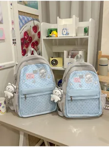 Joli sac à dos scolaire bleu pour étudiants avec patch de dessin animé et pendentif en peluche.