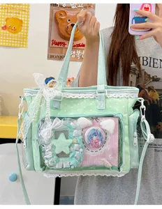 Mint green ita bag with lace, clear window for anime badges, stylish crossbody shoulder bag.