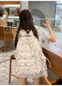 Korean style fresh printed backpack for women, casual campus school bag with chic pattern.