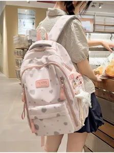 Japanese style cute pink heart print backpack for women, casual school bag for daily use.