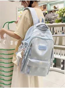 Cute printed school backpack for women, casual Japanese style daily daypack with cloud pattern.
