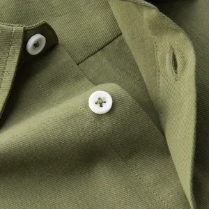 Men casual solid cotton turn-down collar shirt detail view featuring green fabric.