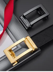 Close-up detail of luxury men's leather belt with metallic automatic buckle and monogram strap.