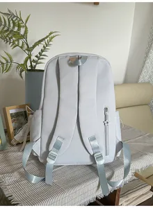 Light grey casual backpack featuring a cute star zipper pull, perfect for daily school and trips.