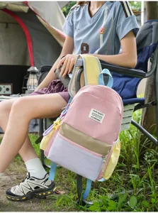 Casual colorblock school backpack for women, lightweight travel daypack with multiple pockets.