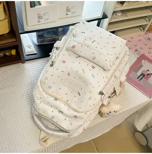 Japanese style cute white student backpack with colorful stars pattern and cloud pendant.