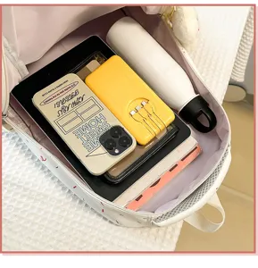 Interior capacity detail view of cute school backpack showing spacious storage for daily items.