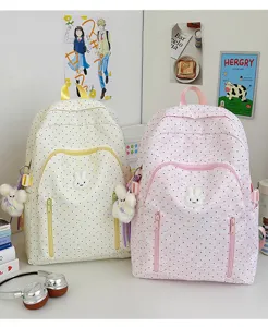 Cute polka dot canvas backpack for teen girls, large capacity school bag with rabbit pendant.