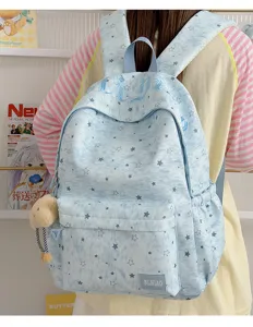 Blue star print school backpack with front pocket and shoulder straps for daily commuting.