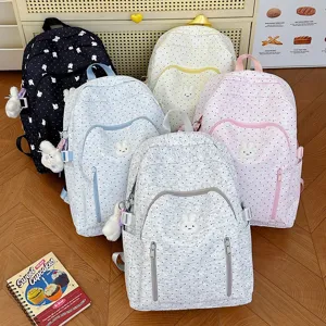 Cute polka dot school backpack for teen girls, large capacity cartoon bunny book bag for high school.