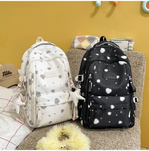New Korean style fresh canvas backpack for women Japanese casual print school bag for daily use.