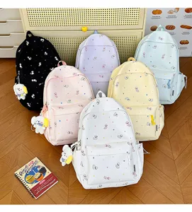 Cute cat pattern casual canvas backpack for women and students, stylish daily travel school bag.