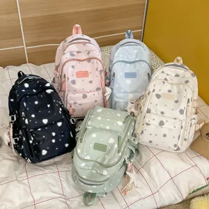 Korean style printed backpack for women, cute heart pattern school bag for daily use.