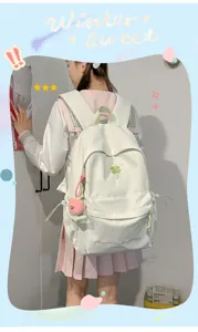 Minimalist solid color casual backpack student school bag with cute embroidery and pendant.