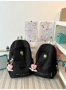 Minimalist casual nylon school backpack for women with cute clover embroidery and pendant.