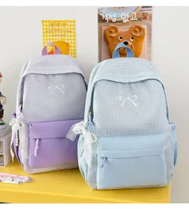 Sac à dos étudiant à carreaux élégant avec broderie nœud et pendentifs perles pour les déplacements.