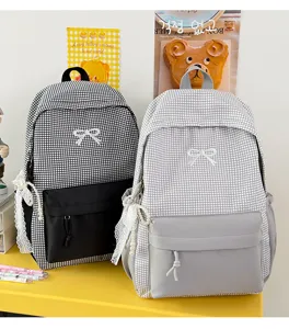 Sac à dos à carreaux décontracté avec joli nœud, grande capacité, sac d'école quotidien pour femmes.