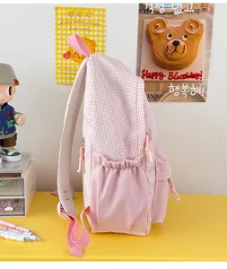 Sac à dos d'école à carreaux rose, sac de jour élégant pour étudiant avec poches latérales.