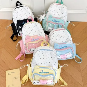 Cute polka dot school backpack with transparent front pocket and plush toys for students