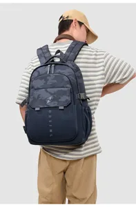 Detailed view of the large capacity nylon camouflage casual backpack for men and students.