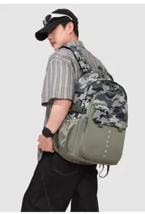 Detailed view of the tactical camo backpack showing durable oxford fabric and multi pockets.