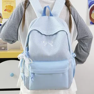Magnifique sac à dos à carreaux bleu clair pour femme avec joli nœud, cartable élégant.