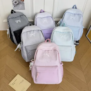 Joli sac à dos d'école à carreaux avec nœud, sac à dos quotidien décontracté pour femmes.