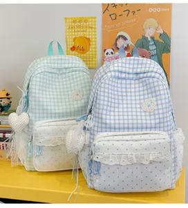 Sweet Japanese style plaid backpack with lace trim, polka dot front pocket and cute heart pendant.
