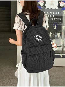 Detailed view of women casual grid backpack, Harajuku style school bookbag with cute plush.