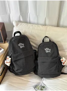 Casual black grid backpack set with cute cat pendant, lightweight schoolbag for daily commute.