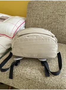 Casual striped canvas backpack for women, lightweight school bag for daily travel.