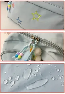 Lightweight school backpack detail view featuring cute star embroidery and waterproof fabric.