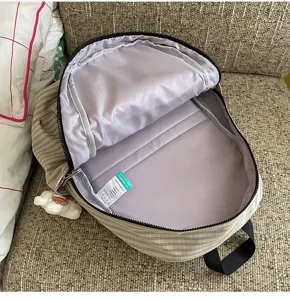 Casual plaid backpack for women, cute daily daypack with roomy interior and inner storage.