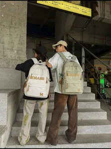 Detailed view of large-capacity student backpack with retro letter print for daily use