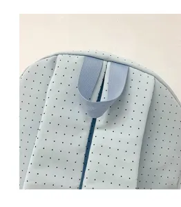 Detail view of a cute Japanese style light blue polka dot backpack with sturdy straps for students.