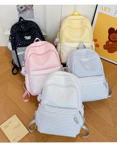 Cute polka dot school backpack for students, large capacity casual daypack in multiple colors.