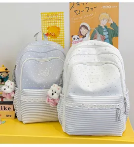 Cute polka dot student backpack with large capacity and stylish casual design for daily use.