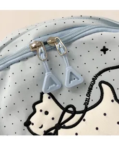 Cute blue polka dot backpack detail with lovely white dog embroidery and smooth double zippers.