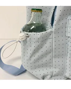 Light blue polka dot school backpack side pocket detail view, cute daily student bag.