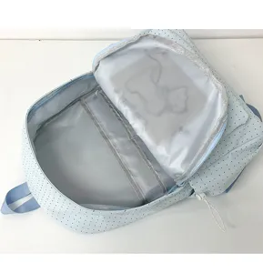 Light blue dotted student backpack interior detail view, showcasing multi compartments.