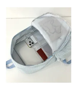 Light blue polka dot school backpack with multi-pocket interior for laptop and daily use.