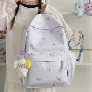 Light purple student school backpack with cute cat prints and plush pendant for daily use and travel.